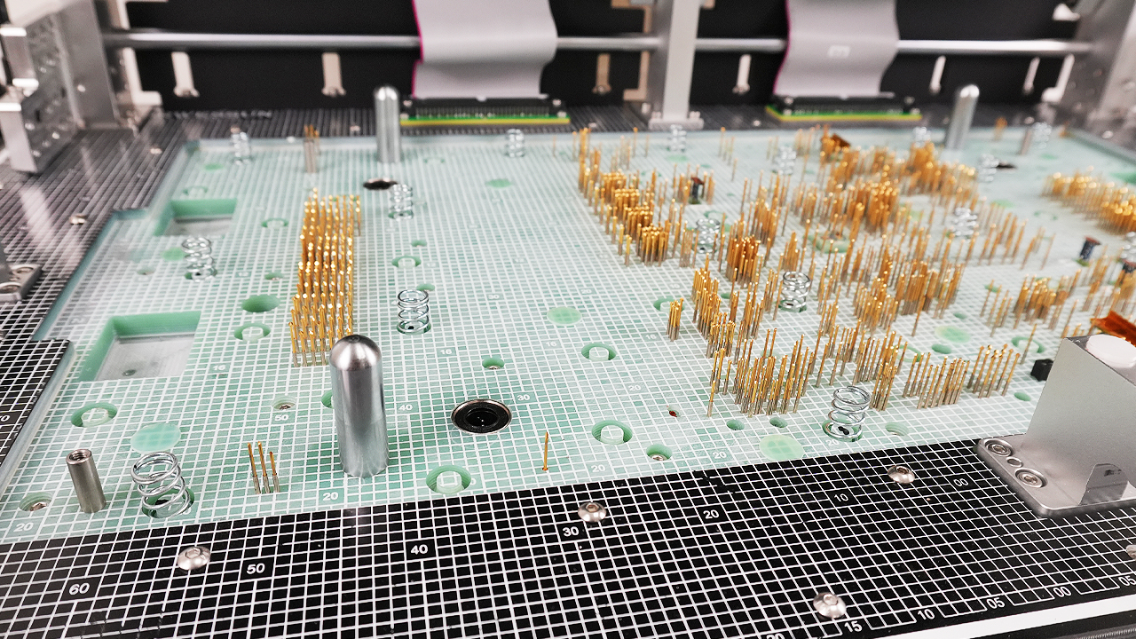 Alto inside Bed of nails pins inside of an in circuit test fixture