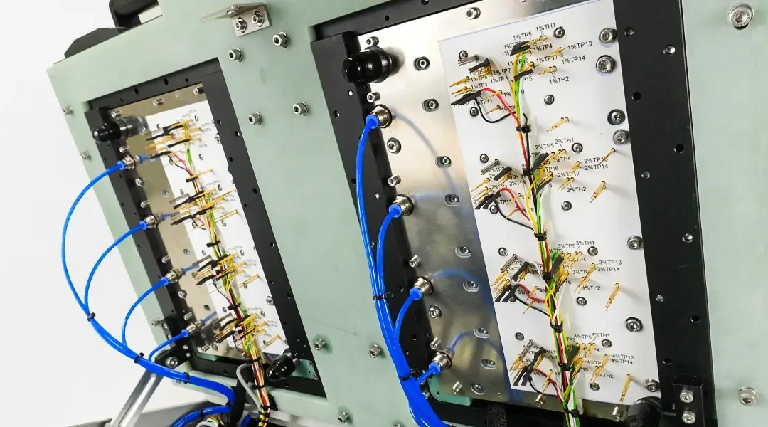 Top section of In circuit test fixture, probes and pneumatic wiring.