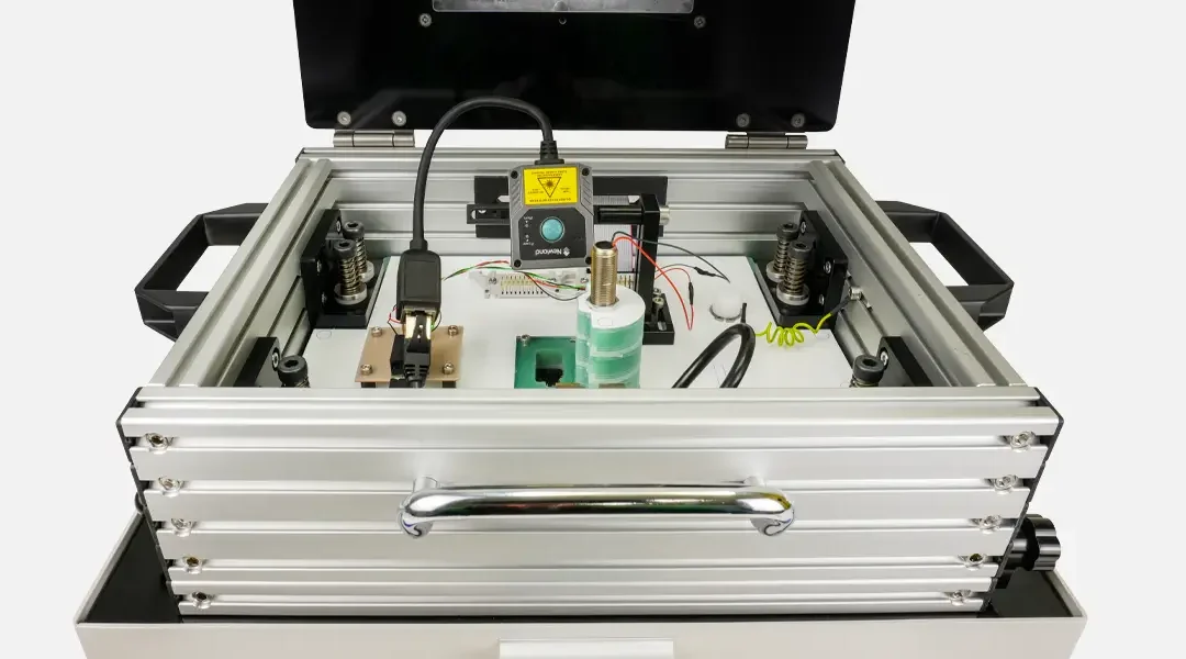 Front on view of an In Circuit Test Fixture, can see automatic barcode scanner.