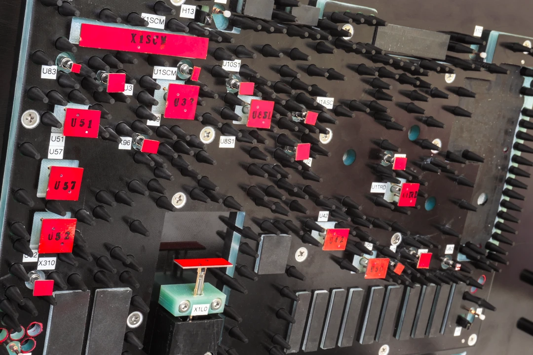 Open-Middle-top-red ICT (In Circuit Test) fixture, showing actuation probes. Closeup.