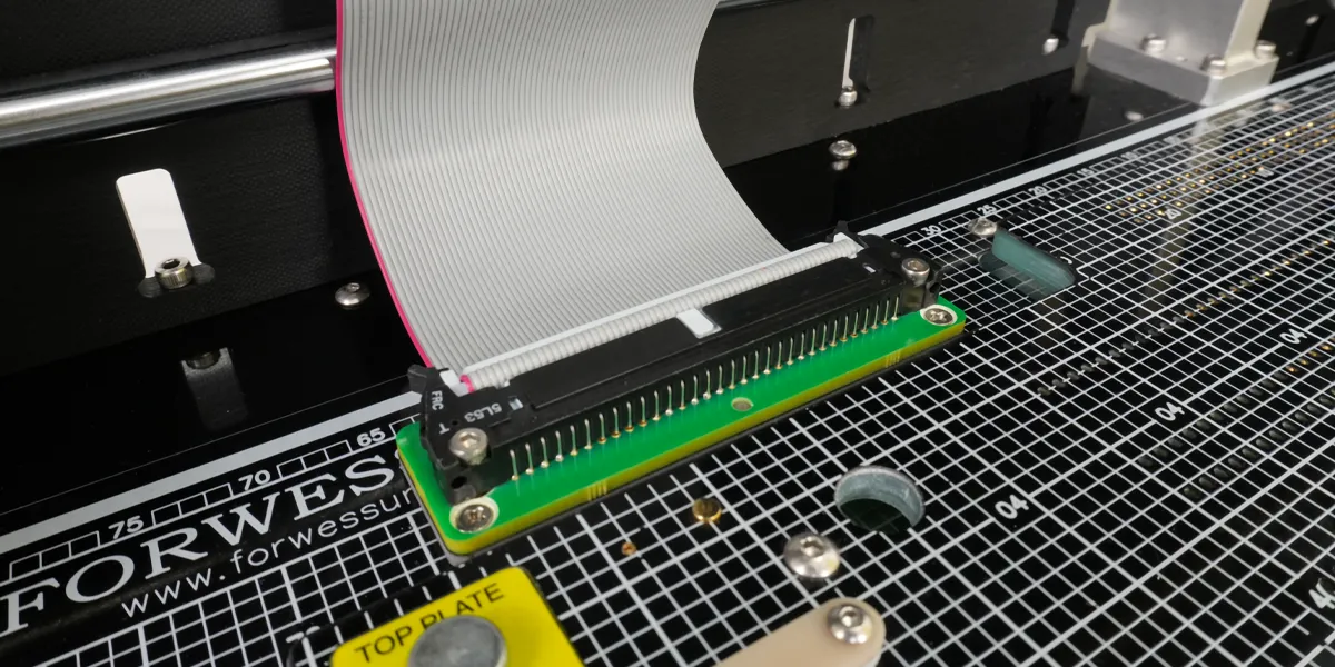 close-up-ribbon Ribbon cable attached to an in circuit test fixture.