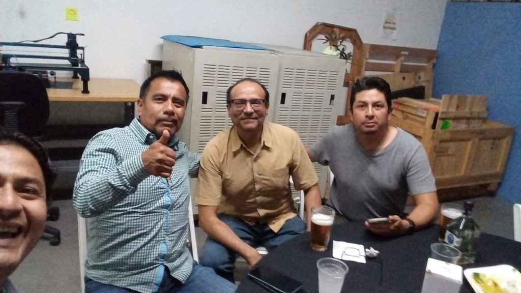 Three attendees smiling at a table during Forwessun Connect in Guadalajara after SMTA Mexico 2026